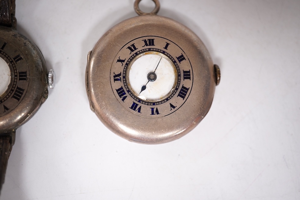 An early 20th century silver Borgel cased manual wind wrist watch(a.f.), one other similar silver half hunter manual wind wrist watch(no strap) and one other similar with a strap. Condition - poor